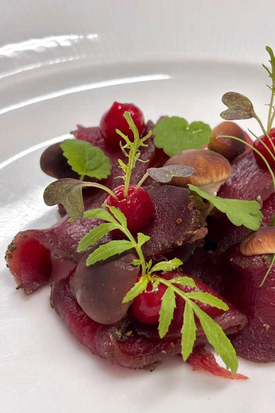 Chianina carpaccio with San Felice EVO oil monocultivar menu Tipico Osteria Montone