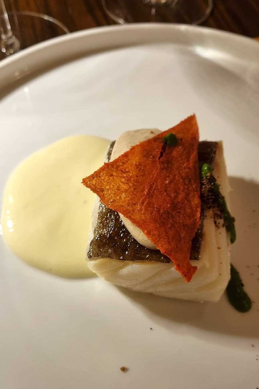 Salted cod fillet with garden panzanella and olives menu Tipico Osteria Montone